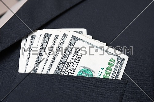 United States dollar (USD) bills - in businessman suit pocket