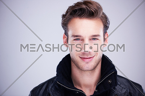 handsome young man portrait isolated on white background in studio