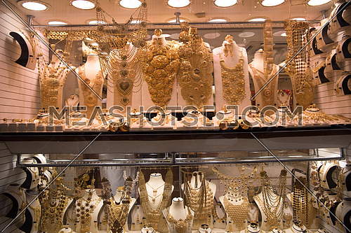 Fashion jewelry from yellow and white gold, on a window shop