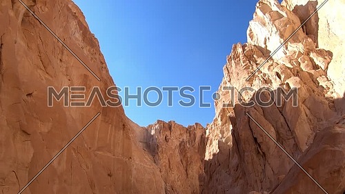 Tilt up shot from inside White Canyon in Sinai at day