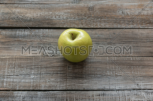 Orcanic yellow apple on wooden boards background. Autumn concept