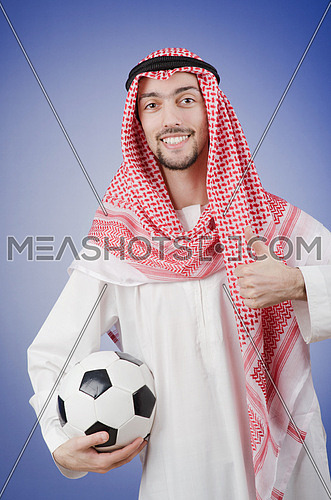 Arab with football in studio shooting