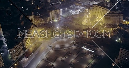 Fly out Drone shot for Tahrir Square showing National Flag Pole in Cairo at night