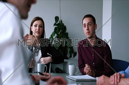  Group of business people discussing business plan  in the office