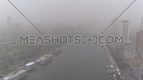 Fly Over Cairo city in Tahrir Area at Foggy Day.