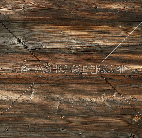 Dark brown old vintage knotty wooden wide planks wall background texture with aged gray and black grunge contrast woodgrain pattern