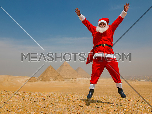 santa claus in egyptian pyramids desert