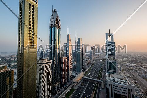 Long shot for Dubai City showing skyscrapers and traffic at day.
