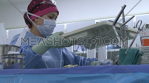 medium shot for nurse working during surgery