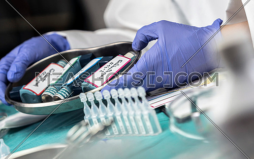 Nurse prepares salbutamol aerosols in a hospital, conceptual image