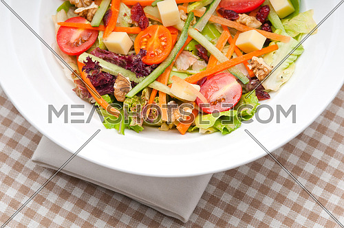 Fresh mixed colorful healthy salad closeup vegetarian food