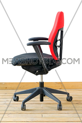 modern red office chair on wood floor over white background