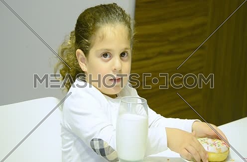 close up for little girl drinking milk