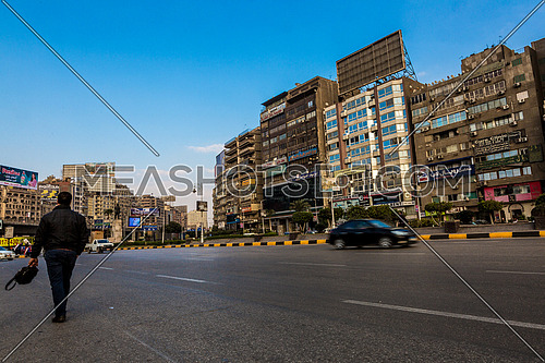 Long shot for traffic in Gamet Al Dowal Street at Cairo at Day