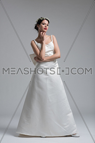 Portrait of beautiful young women in wedding dress isolated on a white background