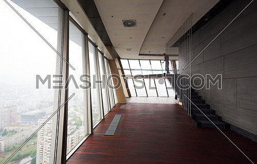 empty penthouse,  modern bright duplex office apartment interior  with staircase and big windows