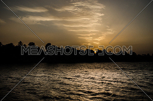 A silhouette of the Nile river during sun set