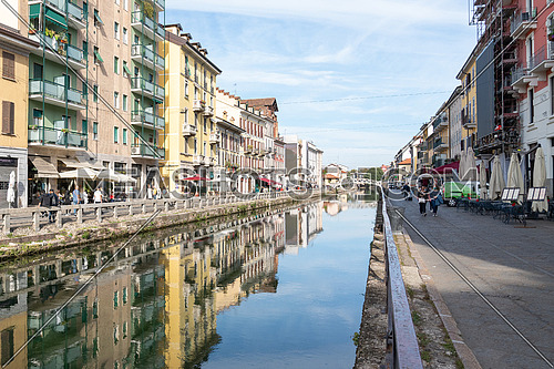Milan,Italy-september 29,2020:People walk with surgical mask for pandemic situation near the Naviglio Pavese Canal in Milan, Italy.