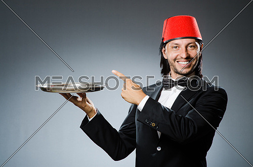 Waiter wearing traditional turkish hat 