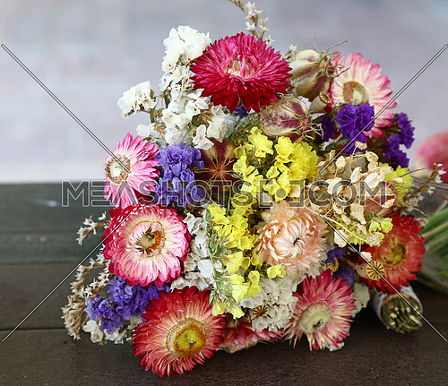 Close up one bouquet of mixed dried flowers on table