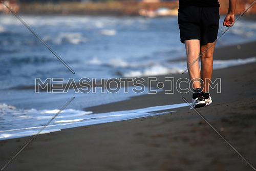 man walking on beach