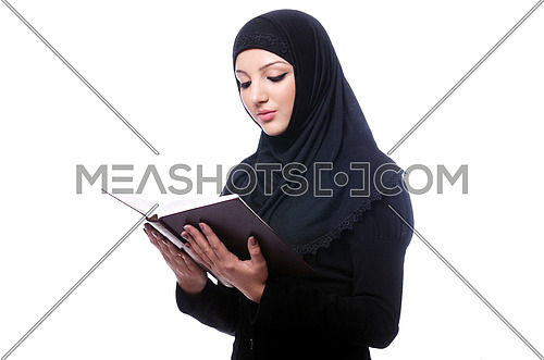 Young muslim woman with book on white