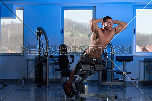 Bodybuilder Doing Heavy Weight Exercise For Back