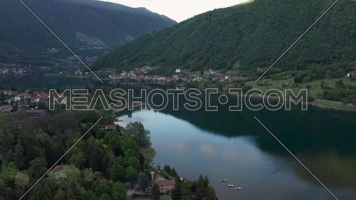 Drone flying over Lake Endine with the mountains in the background,Lombardy,Italy.