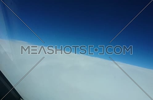 POV shot from plane front flying through clouds 