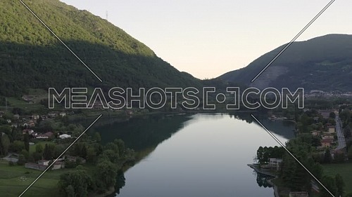Drone flying over Lake Endine with the mountains in the background,Lombardy,Italy.