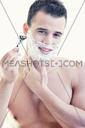 young handsome man have shaving isolated on white 
