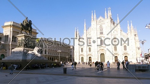 Milan, Italy - May 03, 2021: Crowd of tourists in the square in front of the Duomo of Milan, Italy, many people with masks to protect themselves from