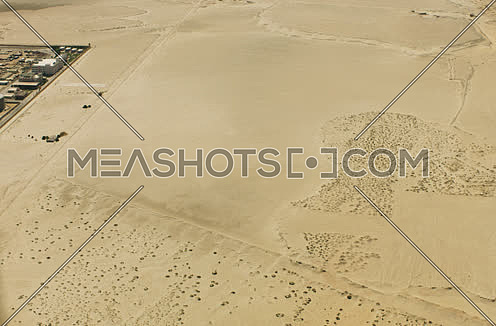 Arial shot for road in the desert to a storage yar in Suez at day