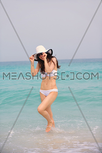 beautifel and happy woman girl on beach have fun and relax on summer vacation  over the beautiful tropical sea