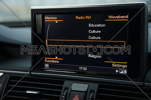 A digital pannel inside a car to control FM radio or mp3 player or cd player