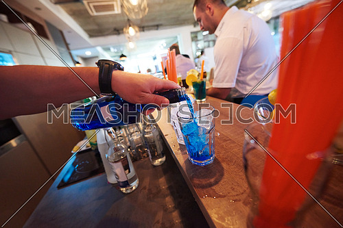 professional  barman prepare fresh coctail drink and representing nightlife and party event concept