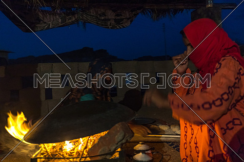 Bedouin Females cooking traditional food at a shelter in Sainai at Night