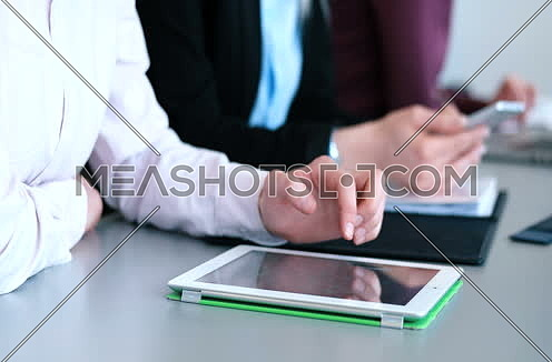 close up of hands using tablet during conference