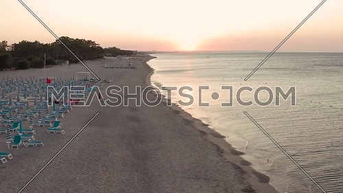 Aerial view of beautiful sea and beach sunrise, seascape and hill mountain on backgrond, Simeri Mare, Calabria, Southern Italy