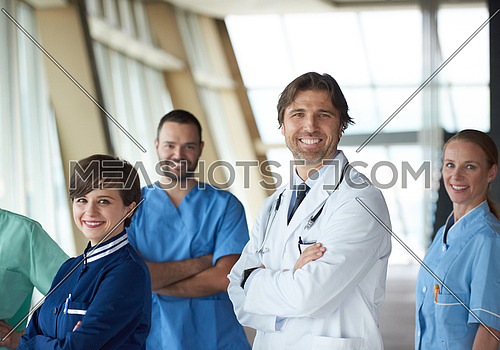 doctors team walking in modern hospital corridor indoors, poeople group