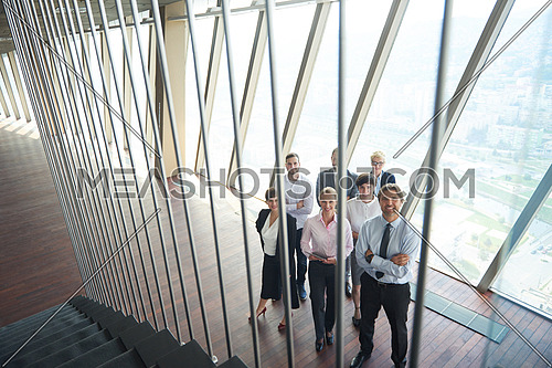 diverse business people group standing together as team  in modern bright office interior