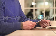 a man using electronic touch devices in a home
