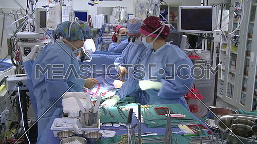 Tilt down for operation room during medical team is performing surgery
