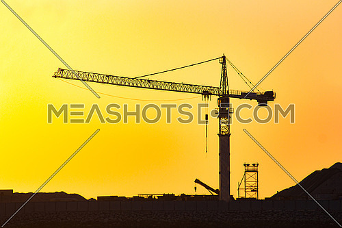construction crane in sunset