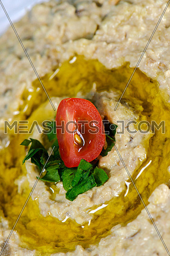 Baba Ghanouj Oriental dish with oil and tomato on the top