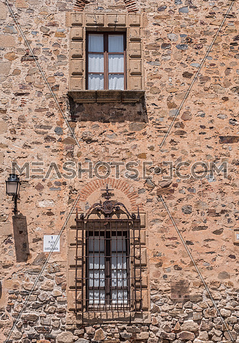 Typical window of the old town of Caceres, Spain