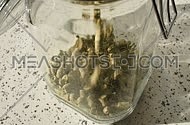 hop pellet in a glass jar
