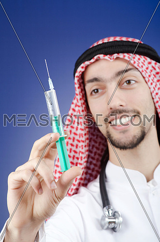 Arab doctor with syringe
