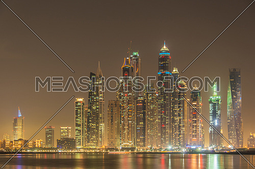 DUBAI - JANUARY 8, 2015: Dubai Marina skyscrapers on January 8 in UAE, DUBAI. Dubai Marina skyscrapers are among the higherst in the world