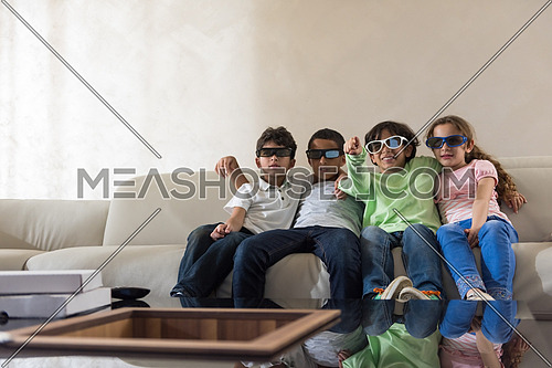 happy middle eastern children watch 3D movies and enjoy in cheerful moments on the sofa